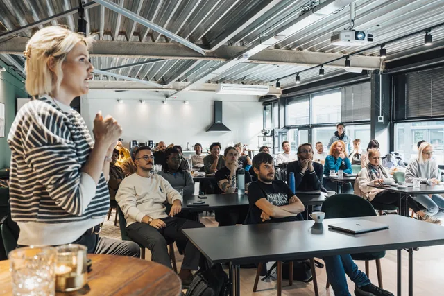 A dynamic speaker engaging a diverse audience in a modern workshop setting. Social media training review method P09-1.0 applied to two CIM courses: what their pages state and what stays unknown